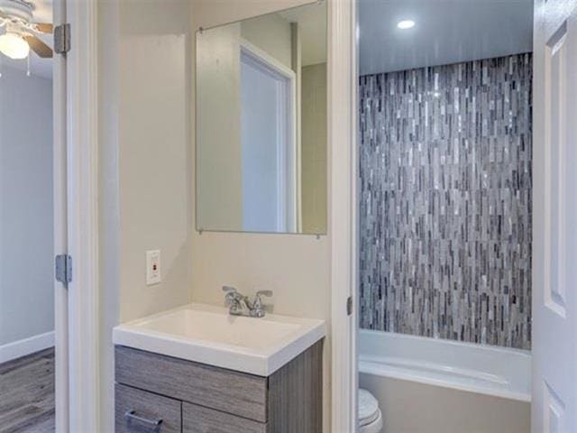3676 Lower Honoapiilani Rd Unit F303, Lahaina, HI 96761 - bathroom featuring hardwood / wood-style floors, vanity, toilet, and ceiling fan
