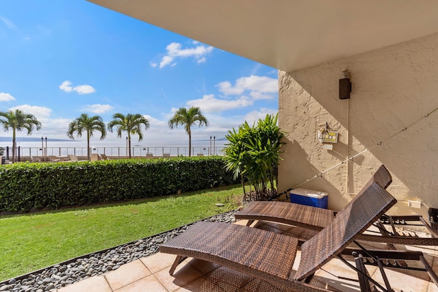 view of patio with a water view