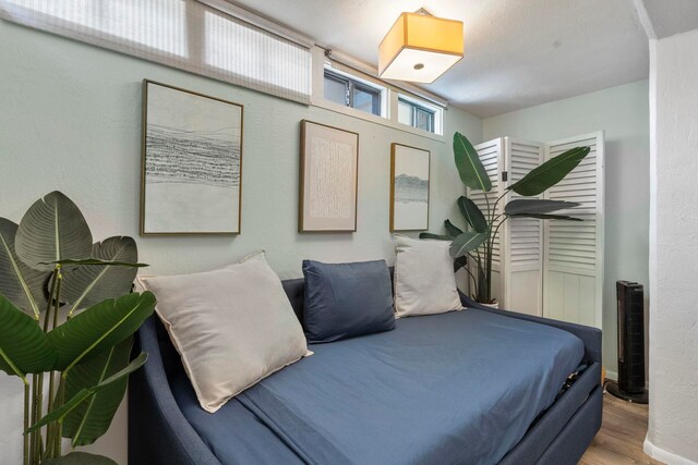 bedroom with light wood-type flooring