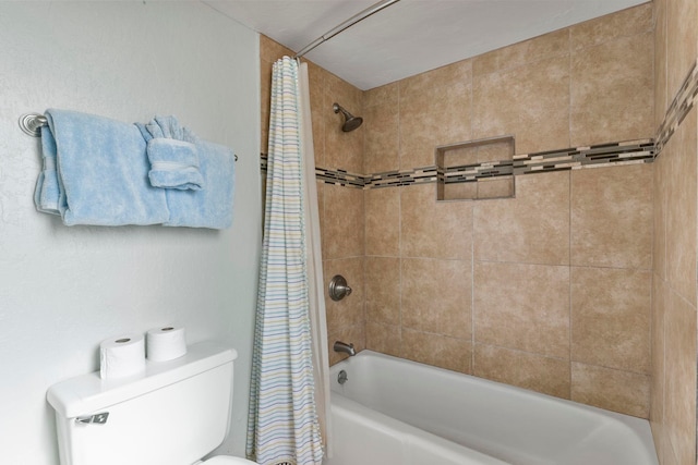 bathroom with toilet and shower / bath combo