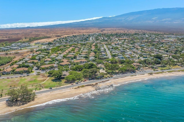 bird's eye view featuring a view of the beach, a residential view, and a water and mountain view