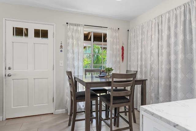 dining area featuring baseboards