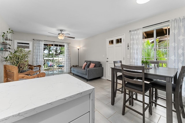 dining area with ceiling fan