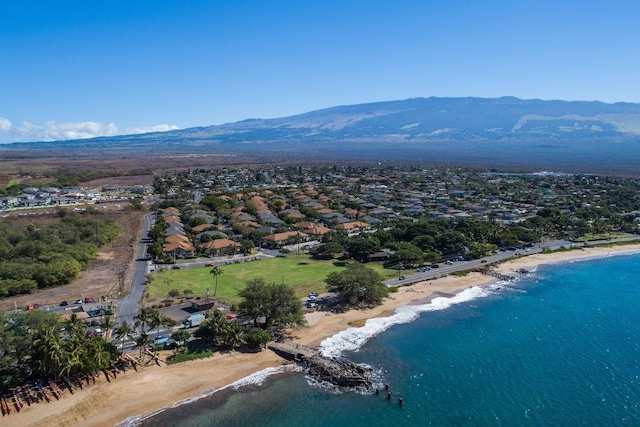 birds eye view of property featuring a beach view and a water and mountain view