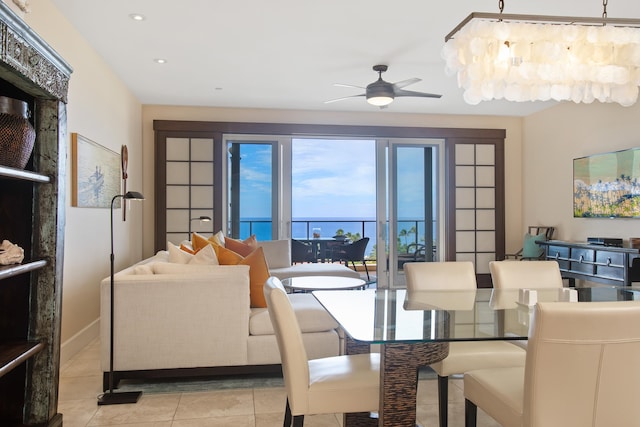 tiled dining space with ceiling fan