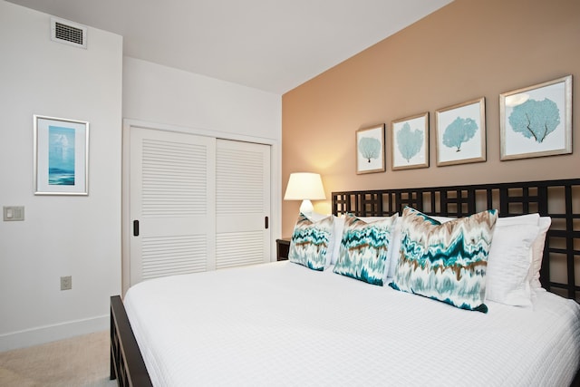 bedroom featuring a closet and carpet flooring