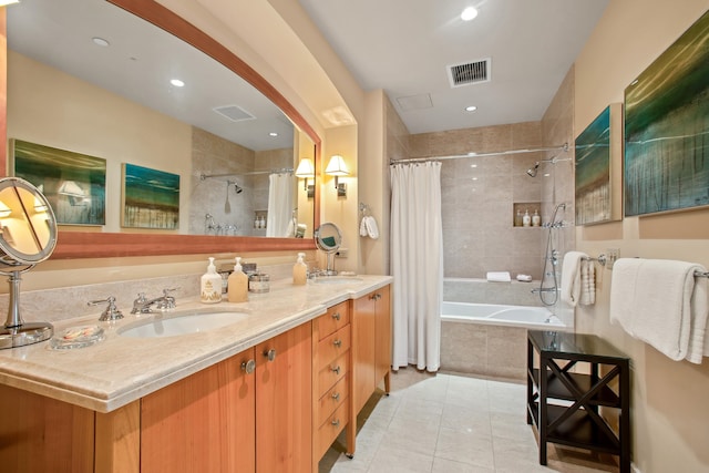 bathroom featuring tile patterned flooring, vanity, and shower / bath combo with shower curtain