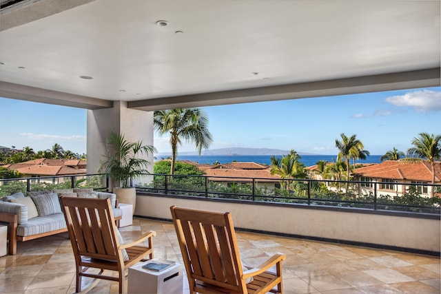 view of patio featuring a water and mountain view