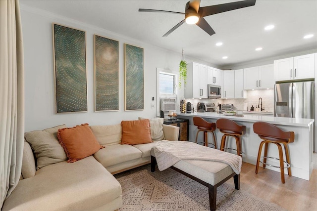 4435 Lower Honoapiilani Rd Unit 142, Lahaina, HI 96761 - living area with light wood-style flooring, recessed lighting, a ceiling fan, crown molding, and cooling unit