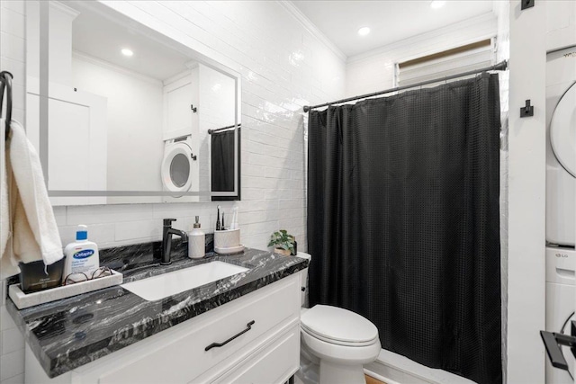 4435 Lower Honoapiilani Rd Unit 142, Lahaina, HI 96761 - bathroom with stacked washer and clothes dryer, ornamental molding, vanity, toilet, and backsplash