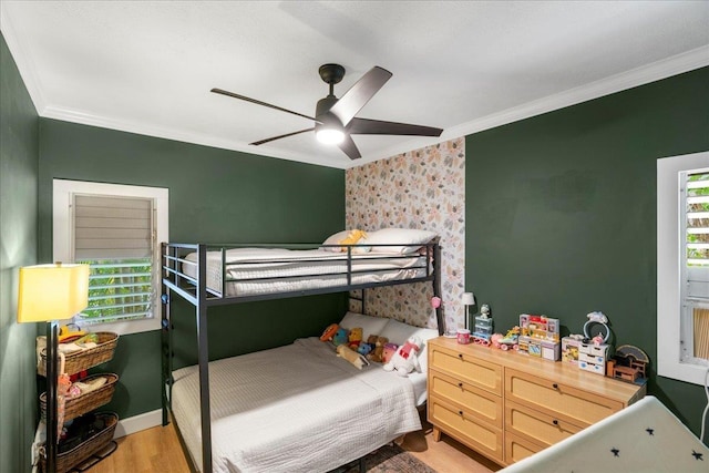 4435 Lower Honoapiilani Rd Unit 142, Lahaina, HI 96761 - bedroom with crown molding, light wood-style flooring, and a ceiling fan