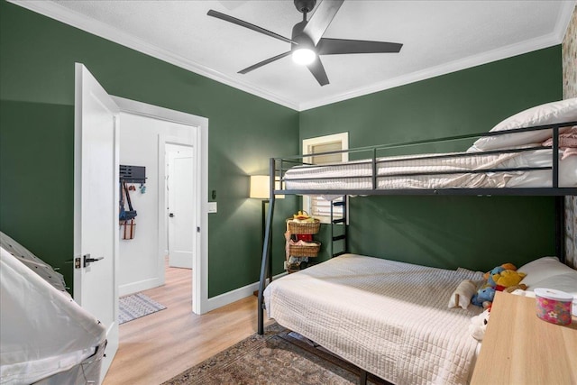 4435 Lower Honoapiilani Rd Unit 142, Lahaina, HI 96761 - bedroom with wood finished floors, crown molding, baseboards, and a ceiling fan