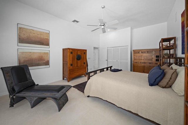 bedroom featuring a closet, ceiling fan, and baseboards