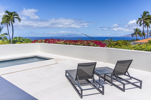 view of patio / terrace featuring a water view