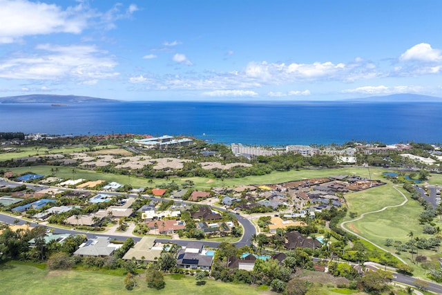 aerial view of property and surrounding area with a large body of water, nearby suburban area, and a local golf course