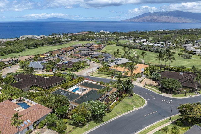 aerial overview of property's location with a water and mountain view and nearby suburban area