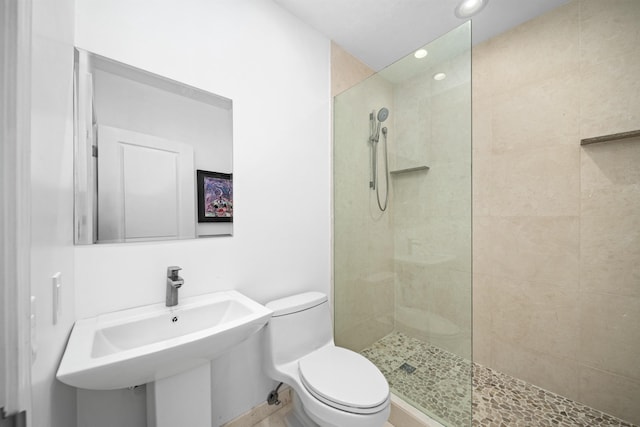 bathroom featuring a walk in shower, toilet, and recessed lighting
