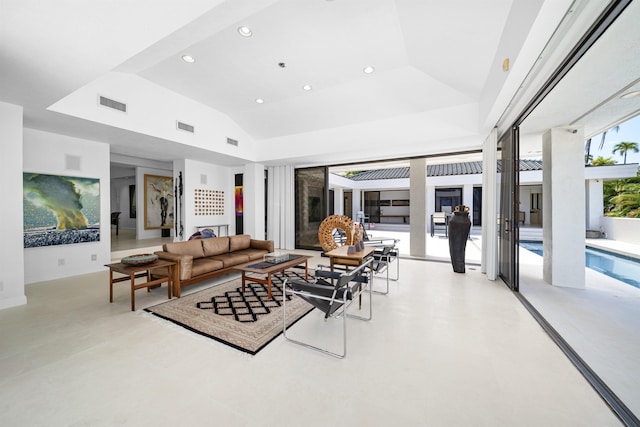 living room with lofted ceiling and recessed lighting