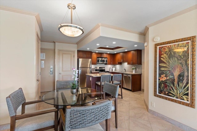 dining area with light tile patterned flooring and ornamental molding