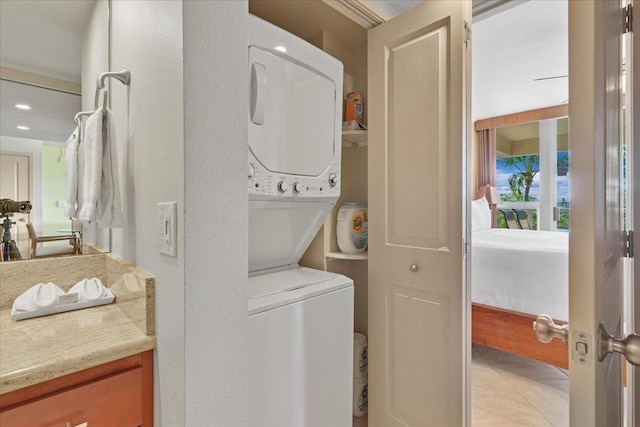 laundry room featuring stacked washer and dryer