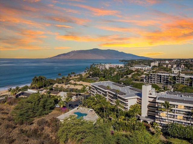 aerial view at dusk with a water and mountain view