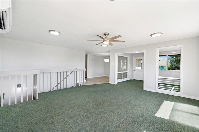 185 Hololani St, Pukalani, HI 96768 - unfurnished room featuring carpet floors, a wall mounted air conditioner, ceiling fan, and baseboards