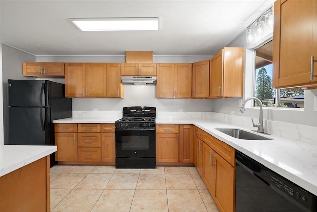185 Hololani St, Pukalani, HI 96768 - kitchen with black appliances, under cabinet range hood, a sink, brown cabinetry, and light stone counters