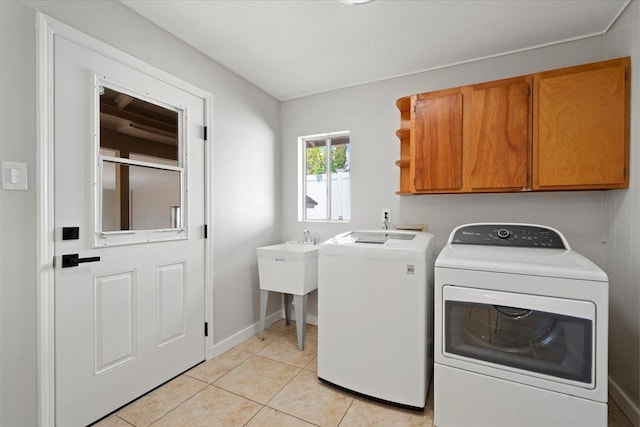 185 Hololani St, Pukalani, HI 96768 - laundry area featuring cabinet space, separate washer and dryer, light tile patterned flooring, and baseboards