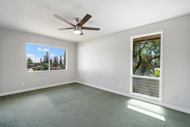 185 Hololani St, Pukalani, HI 96768 - unfurnished room with ceiling fan, dark colored carpet, and baseboards