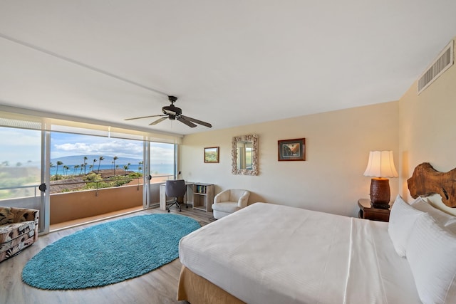 45 Kai Ala Dr Unit A615, Lahaina, HI 96761 - bedroom with wood finished floors, access to outside, and a ceiling fan