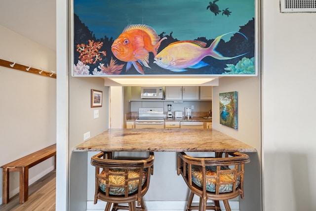 45 Kai Ala Dr Unit A615, Lahaina, HI 96761 - bar with white appliances and wood finished floors