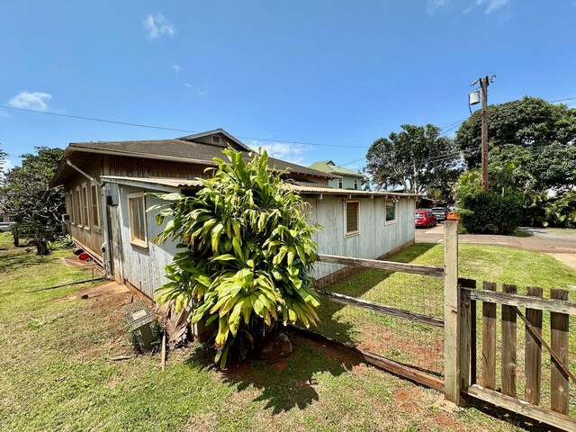 view of property exterior featuring a yard
