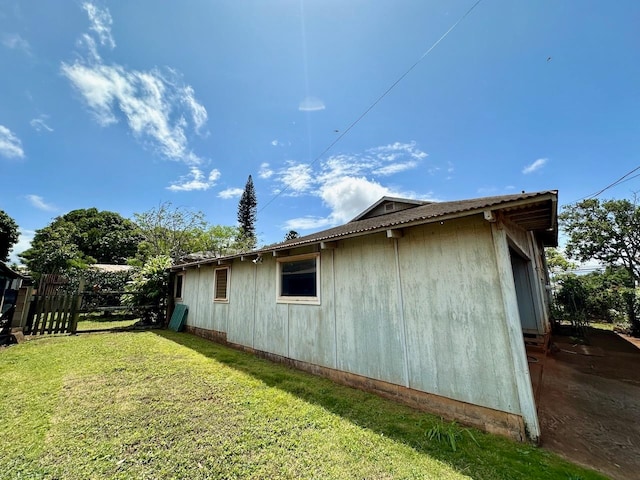 view of property exterior featuring a yard