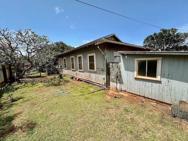 view of home's exterior featuring a yard