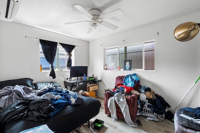 bedroom featuring a ceiling fan and wood finished floors