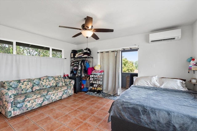 bedroom with light tile patterned floors, multiple windows, a ceiling fan, and an AC wall unit