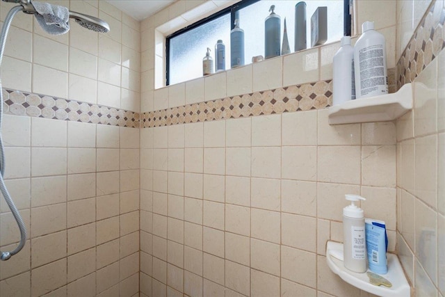 full bathroom with a tile shower