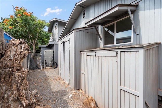 view of home's exterior with fence
