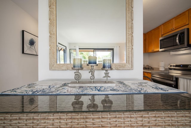 7 Kaiau Pl Unit 6, Kihei, HI 96753 - kitchen featuring stainless steel appliances and brown cabinets