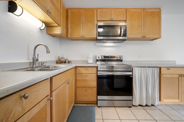 7 Kaiau Pl Unit 6, Kihei, HI 96753 - kitchen with stainless steel appliances, light countertops, light tile patterned floors, and light brown cabinetry