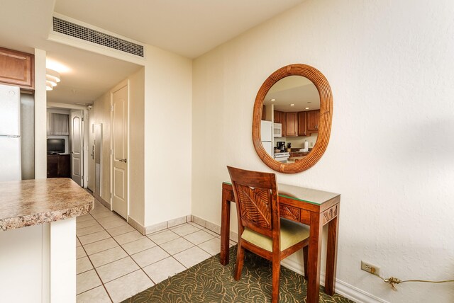 interior space with light tile patterned floors