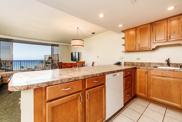 kitchen with sink, kitchen peninsula, light tile patterned flooring, and white dishwasher