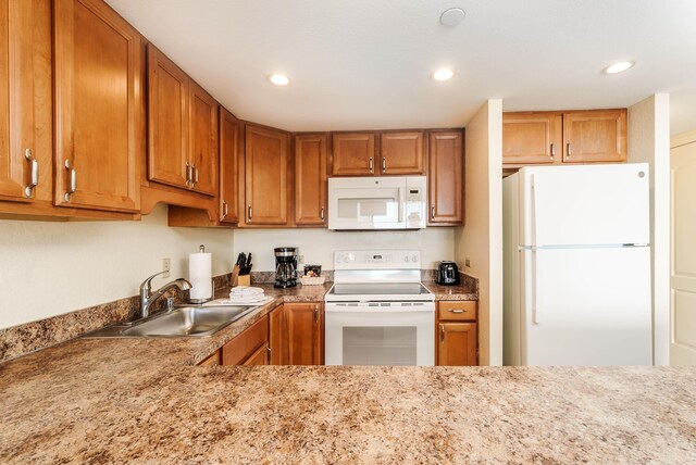 kitchen with sink and white appliances