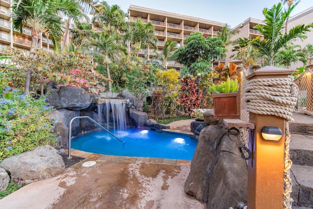 view of swimming pool featuring pool water feature