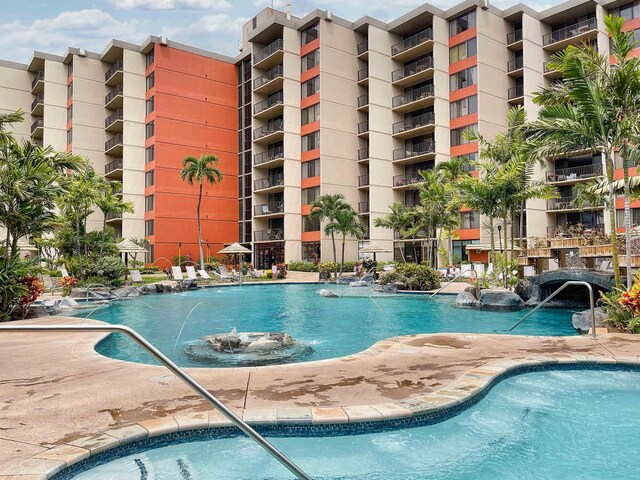 view of pool with pool water feature