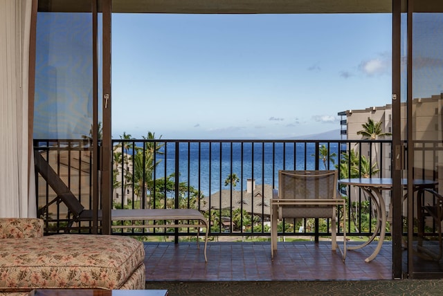 balcony featuring a water view