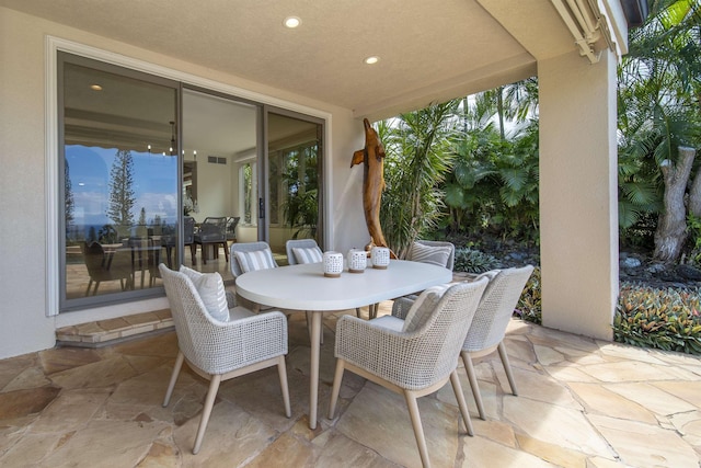 view of patio / terrace featuring outdoor dining space and visible vents