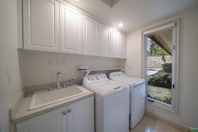 washroom featuring light tile patterned floors, recessed lighting, separate washer and dryer, a sink, and cabinet space