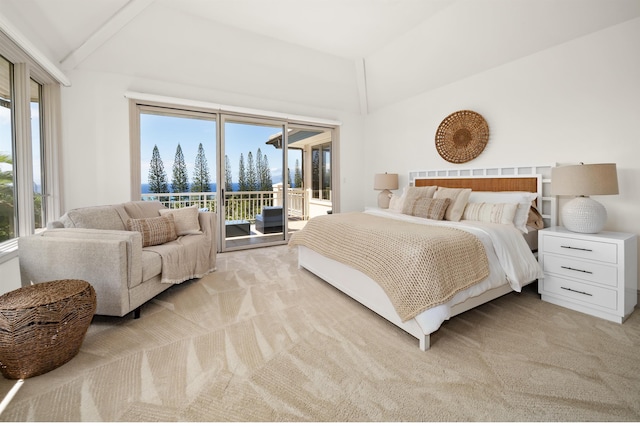 bedroom featuring access to exterior, lofted ceiling, and light colored carpet