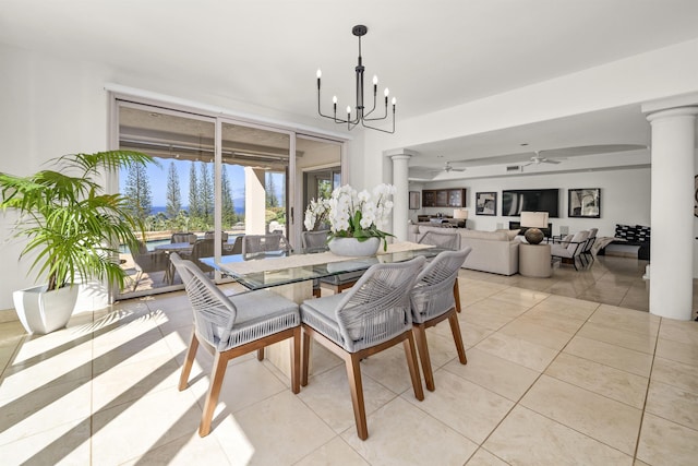 dining area featuring light tile patterned floors, decorative columns, and ceiling fan with notable chandelier